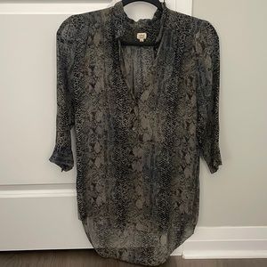 Snake skin blouse, looks great with leather leggings. Longer at the back